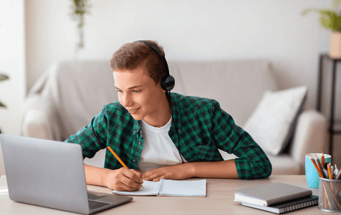 A young student wearing headphones, studying online with a notebook and pencil, representing hybrid learning in a classical C.