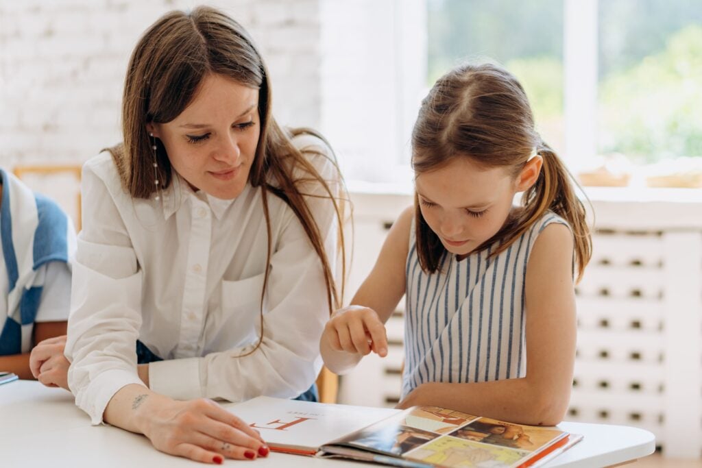 Try a Sample Week of Classical Homeschool - student reading with a mentor