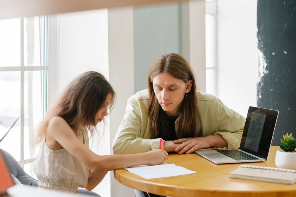 Parent and student working together at a bright table during a 4-hour homeschool day