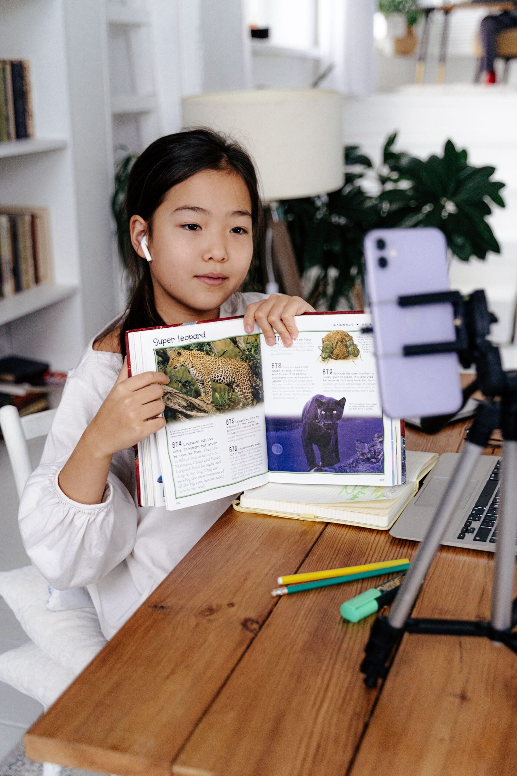 A student holding up her finished work
