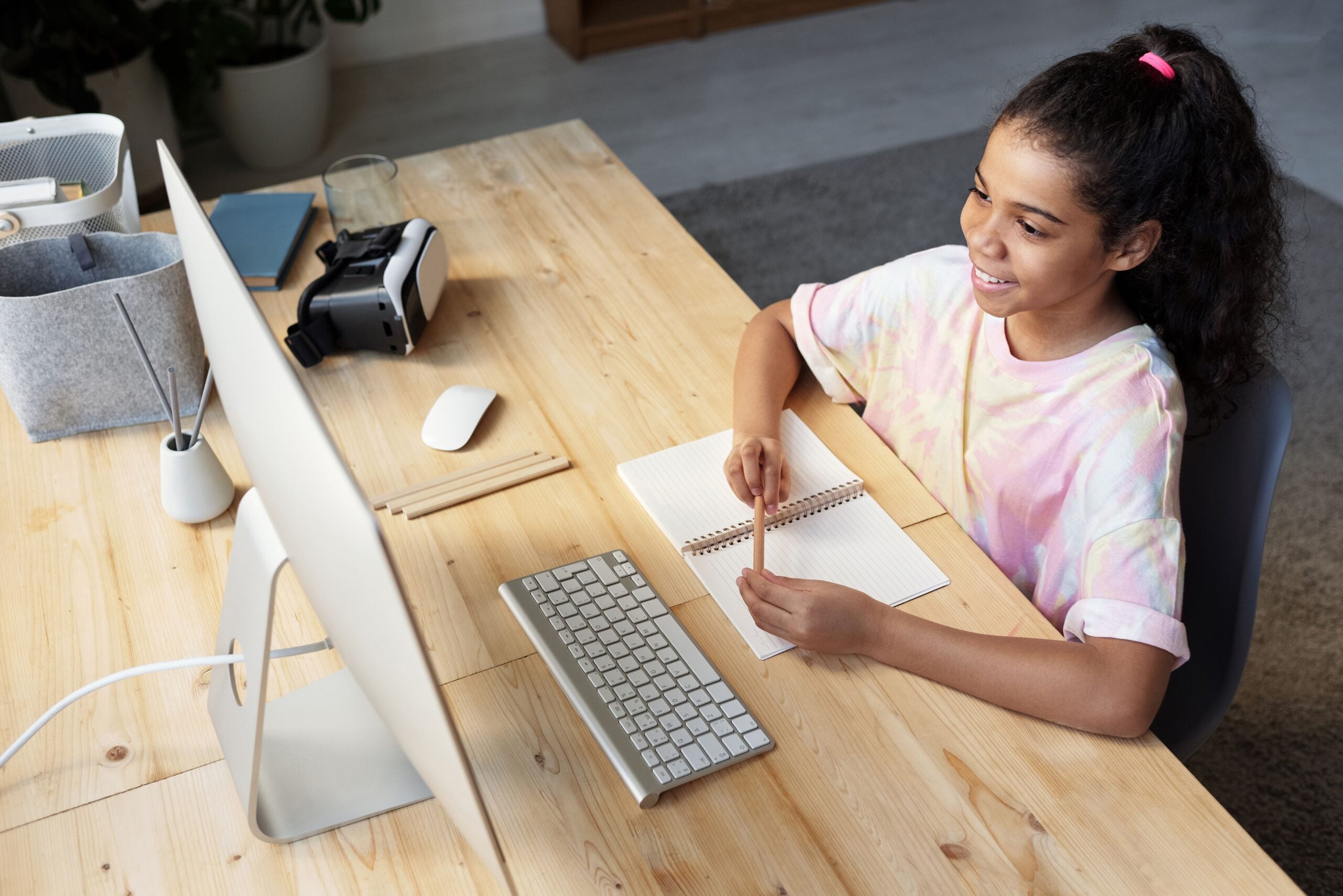 A student at her desk at home working through the week's plan
